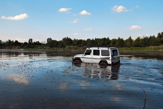 4x4 crossing lake somewhere in Eastern Europe