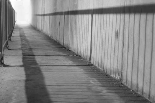 Lighted staircase at the end of an undergroud tunnel