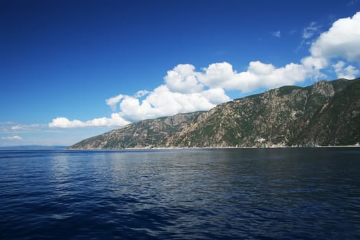 Tropical sea shore, blue sky and dark blue sea