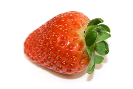 One strawberry closeup isolated on white