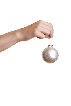 Girl holding a silver christmas ball over a white background