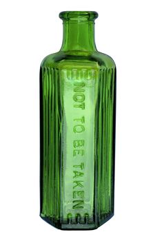 A old green bottle with 'NOT TO BE TAKEN' embossed on the side. This sort of bottle was once used to sell poisons or medicines for external application. Clipping path included.