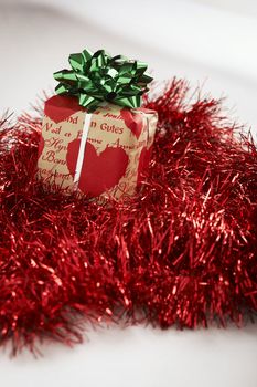 Christmas present on the table with red decoration