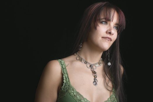 Close up portrait of fashion model in relaxe position with green tank top