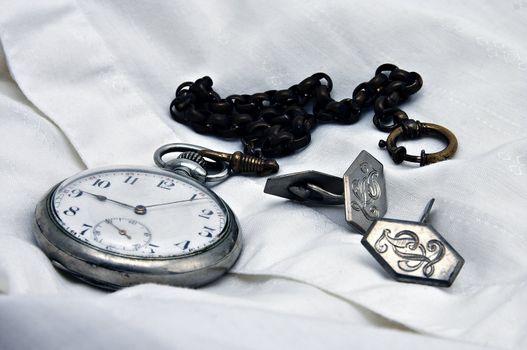 Old pocket watch with shirt and cuff links