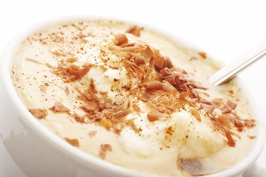 Close up of coffee cup with cream and chocolate