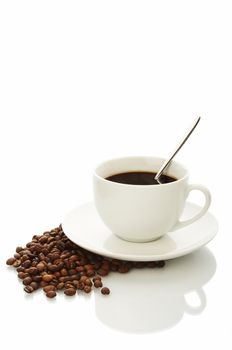White coffee cup with coffee beans