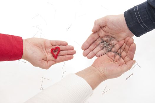 Three hands on white background symbolising complicated relationships.
