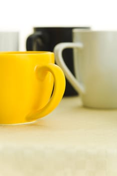 Different coffee cups on the kitchen table