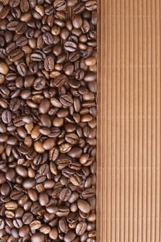 Coffee beans on the brown card board 
