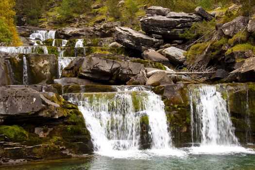 Small cascade in Odessa park in Pyrenees - France