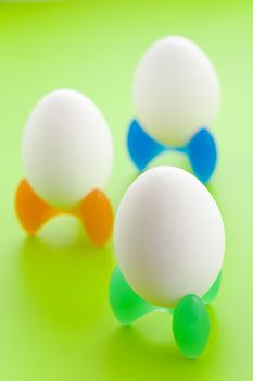 Alien looking eggs over a green background