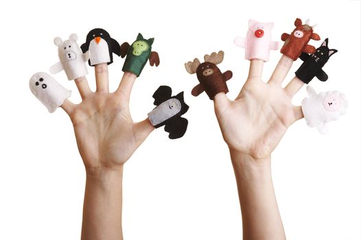 Isolated girl's hands with finger puppet (farm animals, ghost, penguin and dragon)