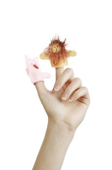 Girl's hand with animal finger puppets (pig, lion)