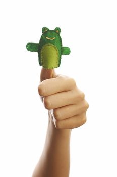 Girl's hand with animal finger puppet (frog)