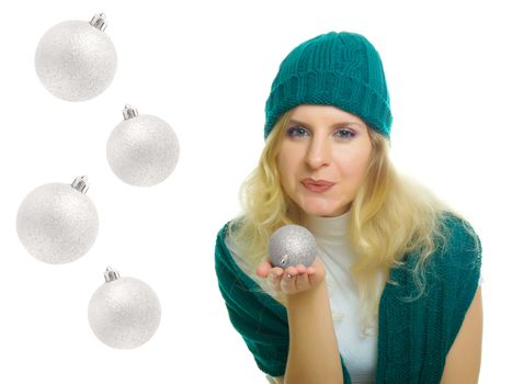 winter woman blowing on the xmas ball with room for text