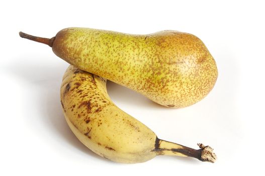 Fruits on the white background (banana and pear)