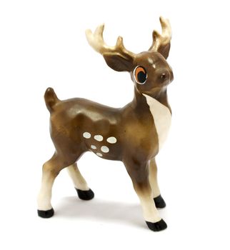 Old vintage ceramic figurine of a deer. 