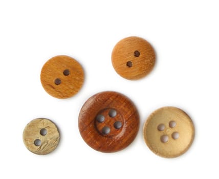 Mix of different wooden buttons, isolated on white background.