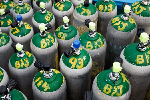 Background of stacked scuba diving oxygen tanks ready for diving
