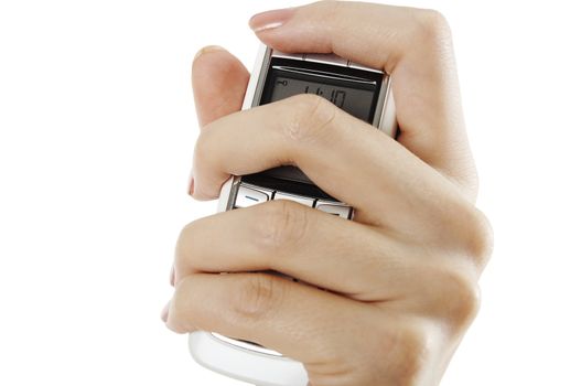 Girl's hand squeezing mobile phone