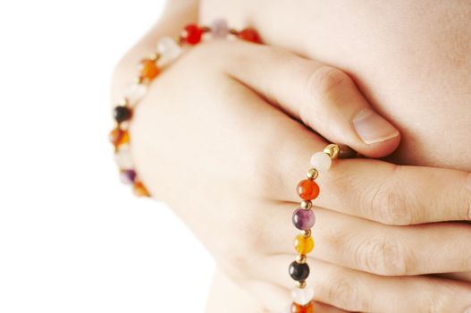 Girl holding hand with jewelry on the hip