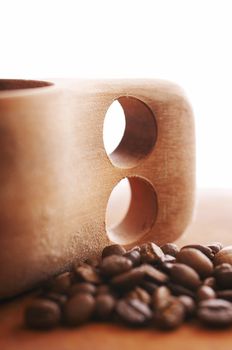 Wooden coffee cup on the white background