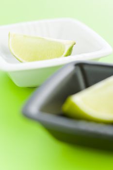 Lime halves on the white and black vases