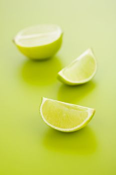 Lime halves over a light green background