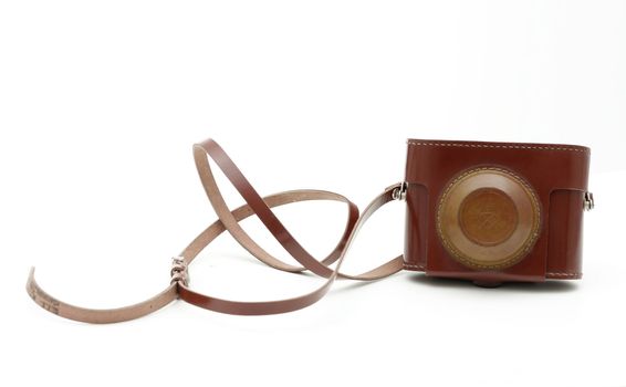 old antique brown analog photo camera bag isolated on white