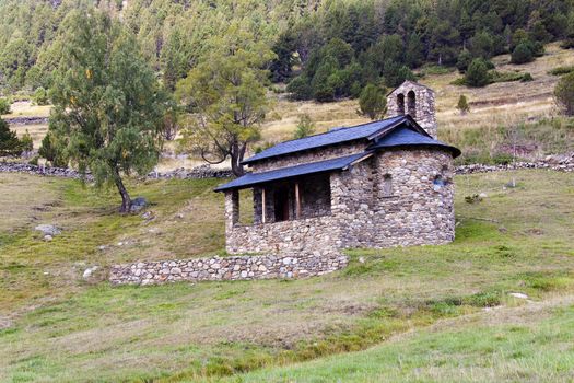 Small, old, stone roadside shrine in Pyrenees mountain - Andorra.