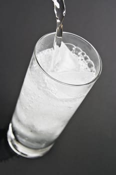 Pouring water in the glass