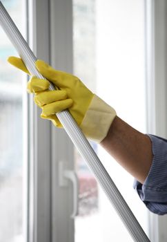 The cleaner washes a window