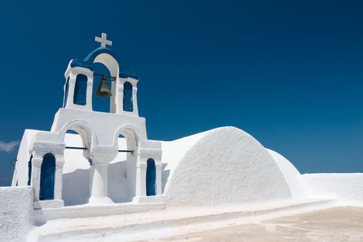 Bell tower on santorini against blue sky