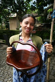 The Indonesian girl sells souvenirs. Bali