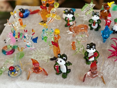 Colorful beautiful glass small animals figurines sculptures on display