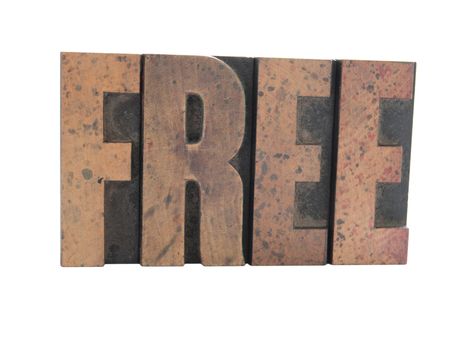 the word 'free' in old wood type letters with a reflection