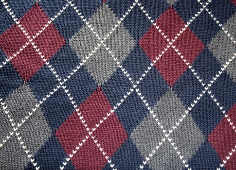 an argyle pattern in maroon, gray and white