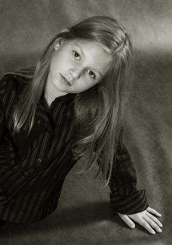 The beautiful young girl  in studio. b/w+sepia