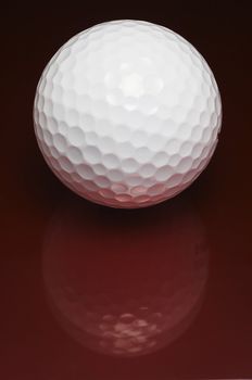 Golf ball with red feflection