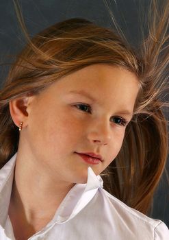 Portrait of the girl close-up with developing hair