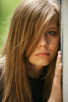 The young girl about a wall, looking frustration