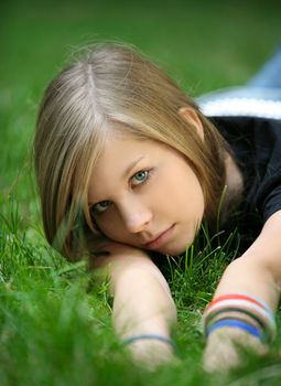 The girl in a grass. The face close-up
