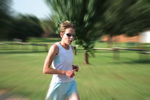 Artistic blur of a female athlete running fast