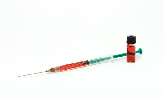 Syringe and vial on white background