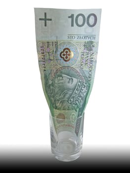 a hundret zloty bill in a goblet