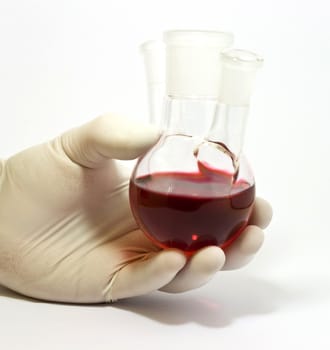 Flask in hand on white background