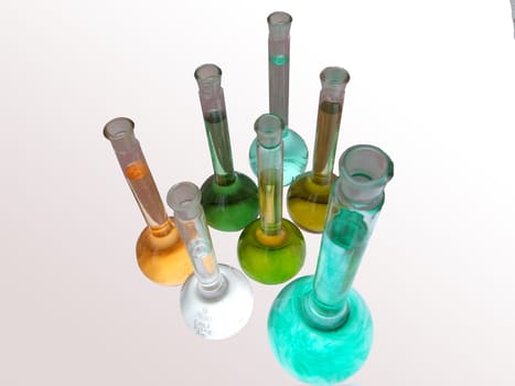 several colored flasks in biochemistry labolatory