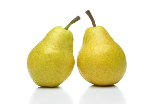 A pair of yellow pears side by side over a white background. Look for more fruits and vegetables at my gallery
