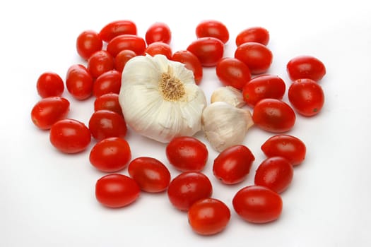 Garlic surrounded by cherry tomatoes. Look at my gallery for more fresh fruits and vegetables.